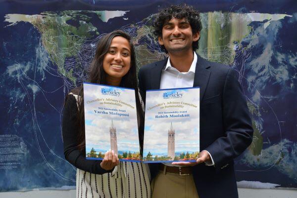 Student award winners, Varsha Madapoosi & Rohith Moolakatt holding their CACS Sustainability Awards