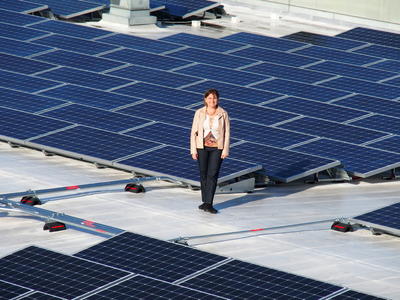 OS Director Kira Stoll atop RSF solar panels